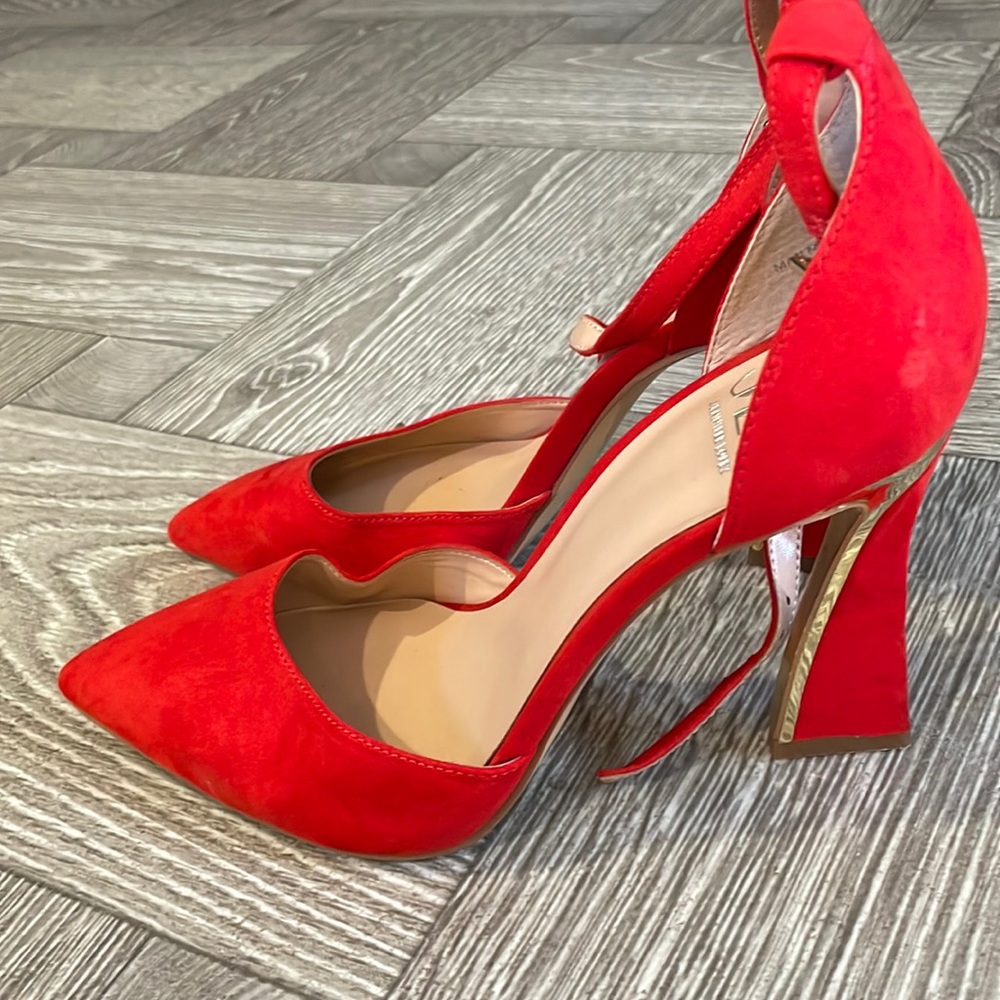 JLO Red and gold heels